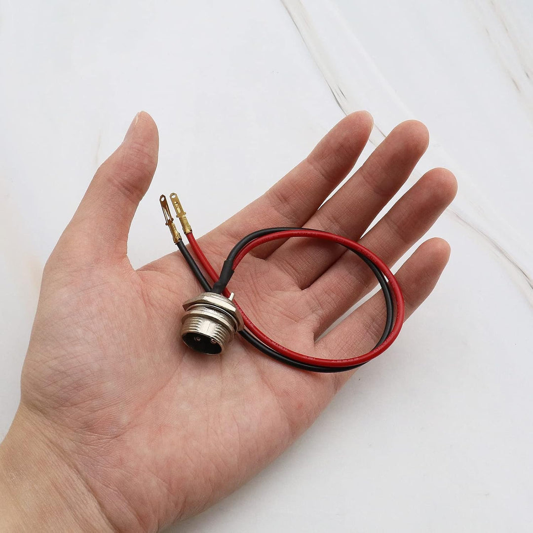 Two black 3-pin 2-wire electric scooter charging-port connectors, view 4