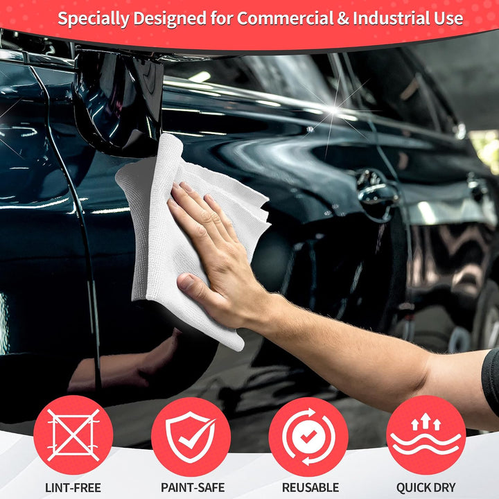 white microfiber cloth cleaning a black car