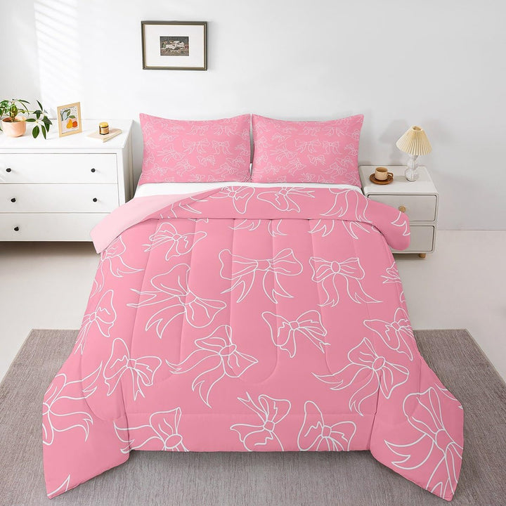 Pink bow twin comforter set on bed