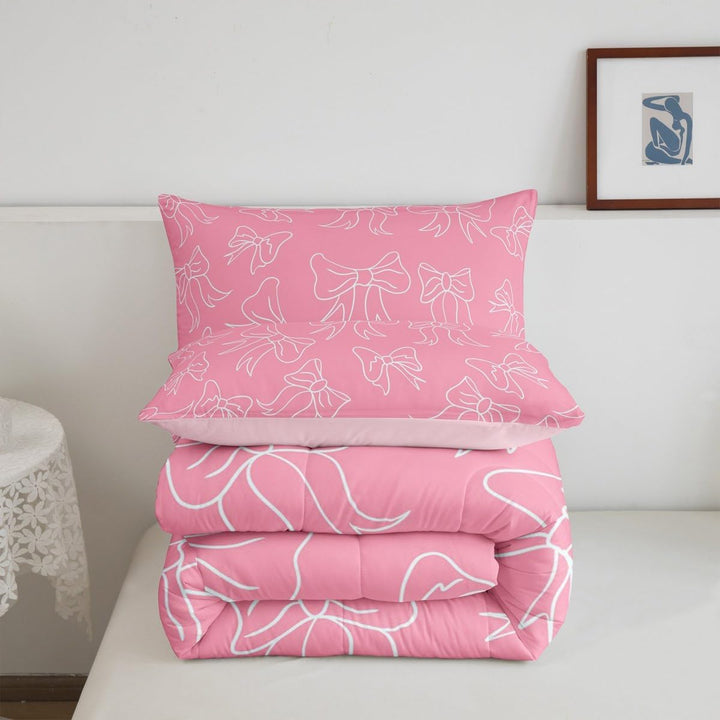 Pink bow comforter and matching pillowcase folded