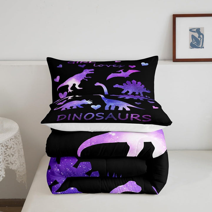 Folded purple dinosaur comforter and pillowcase