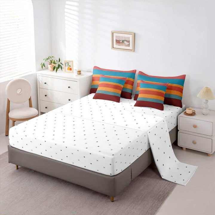Twin fitted sheet and striped pillowcases on bed