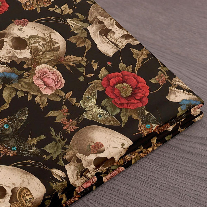Folded black skull and rose upholstery fabric