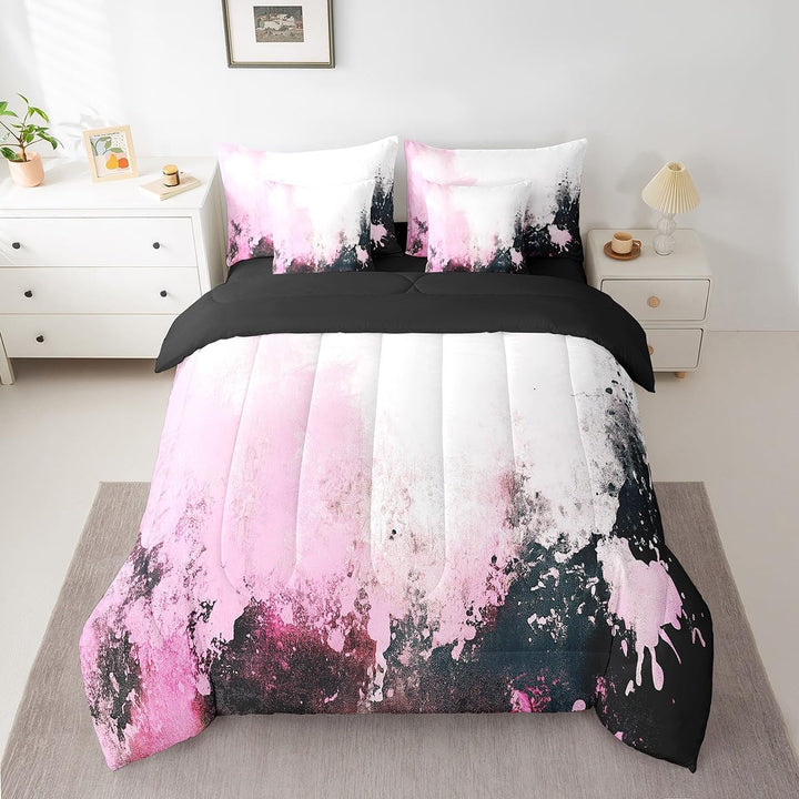 Pink white and black abstract full comforter set on bed