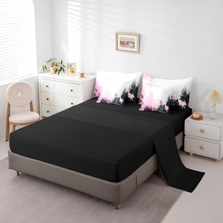 Black sheet with pink abstract pillowcases