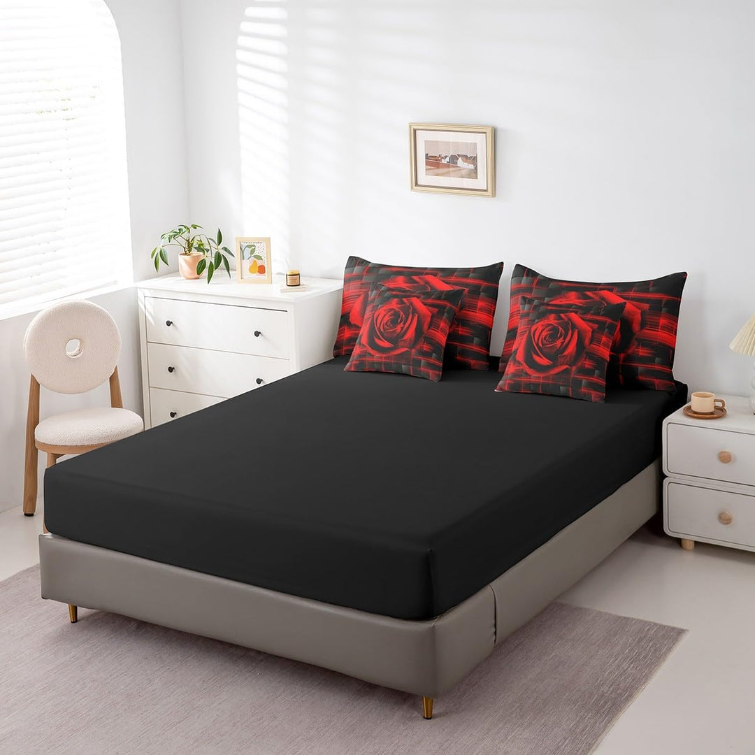 Black fitted sheet and rose-pattern pillows