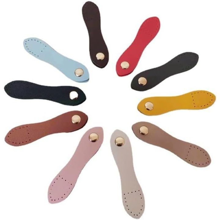 Assorted colour leather snap closures laid out