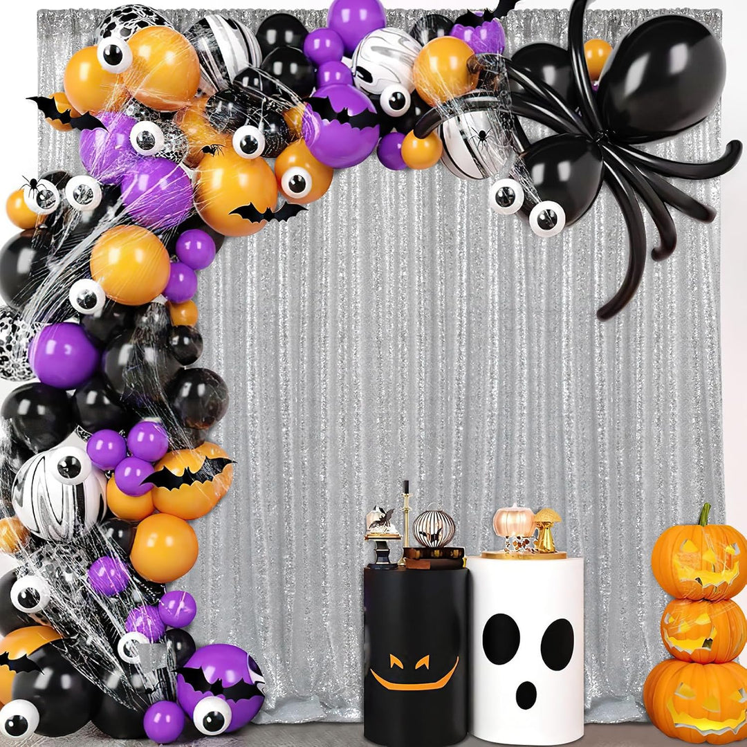 Silver sequin backdrop with Halloween party decorations