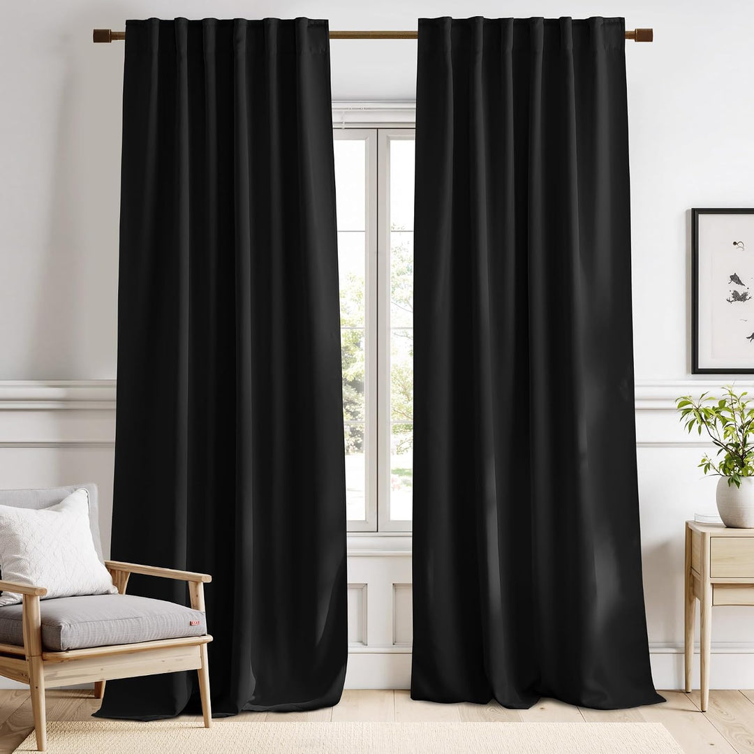 Black 52 x 120 inch two-panel curtains in a room