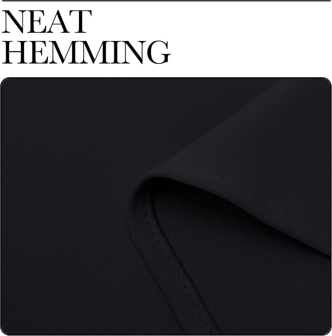 Finished hem of black curtain panel