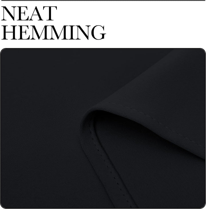 Finished hem of black curtain panel