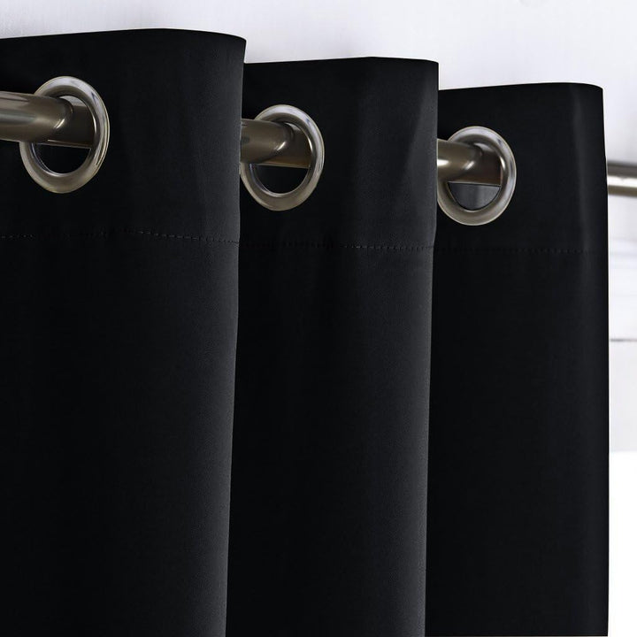 Black room-divider curtain grommet detail