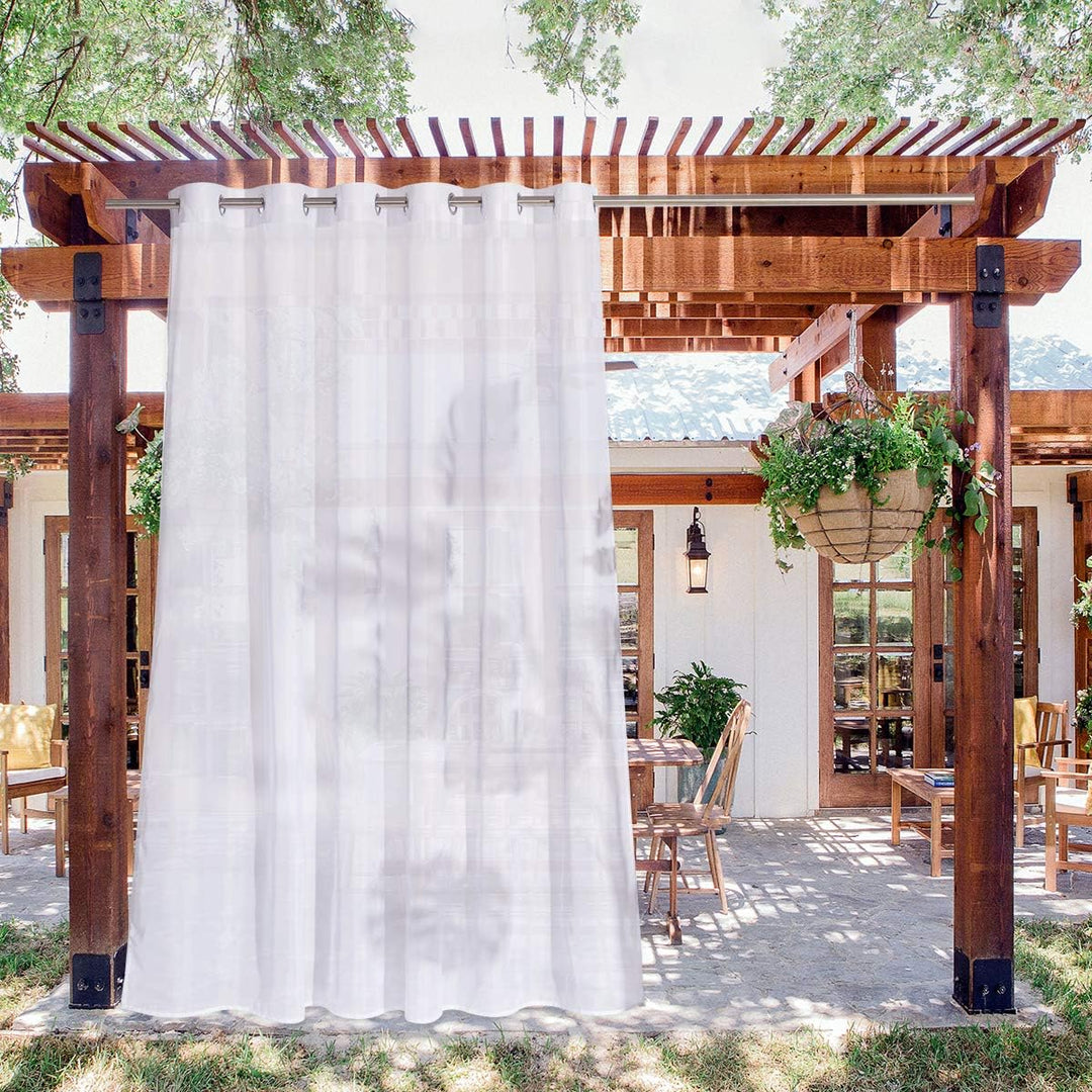 White sheer outdoor curtain panel on pergola