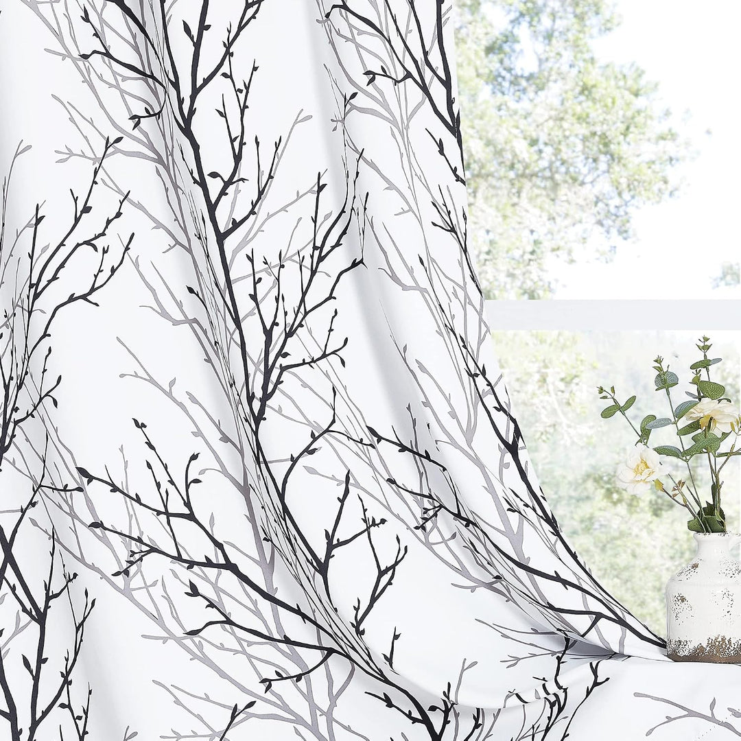 Branch-pattern room-darkening curtain drape detail