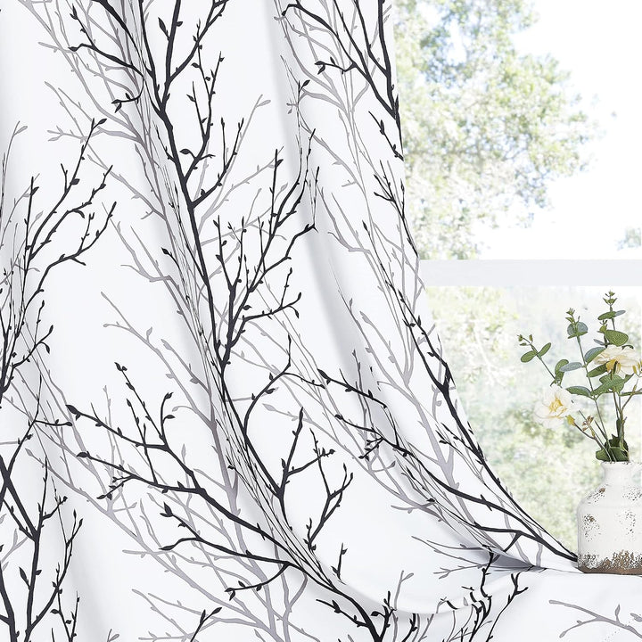 Branch-pattern room-darkening curtain drape detail