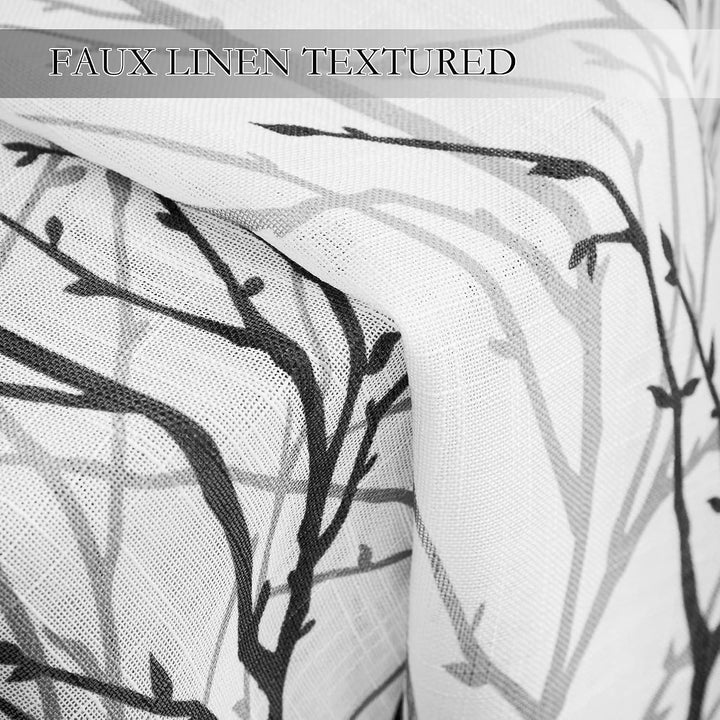 Close-up of black and grey branch-print sheer fabric