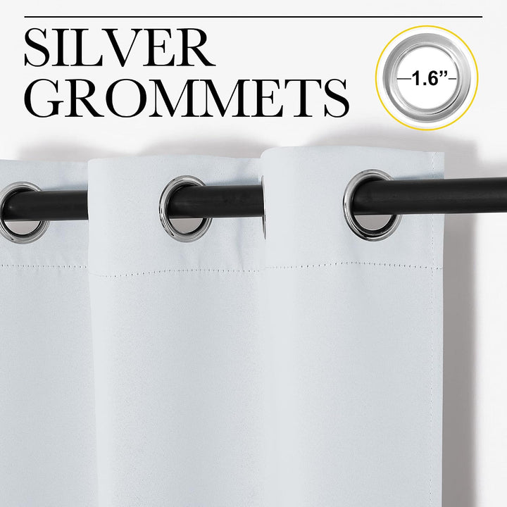 Silver grommets on greyish white curtain panel