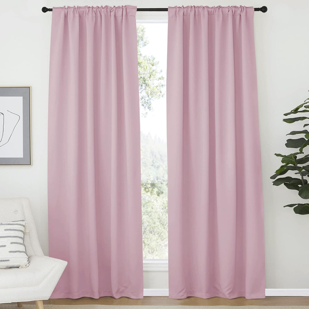 Baby pink curtain pair hung with rod pockets