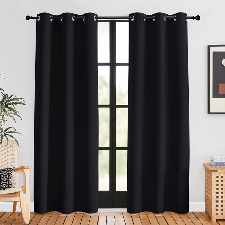 Black 42 x 80 inch grommet blackout curtain pair in a room