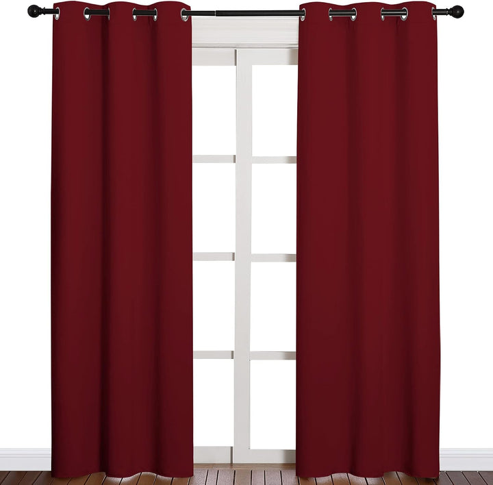 Burgundy red two-panel curtains on window
