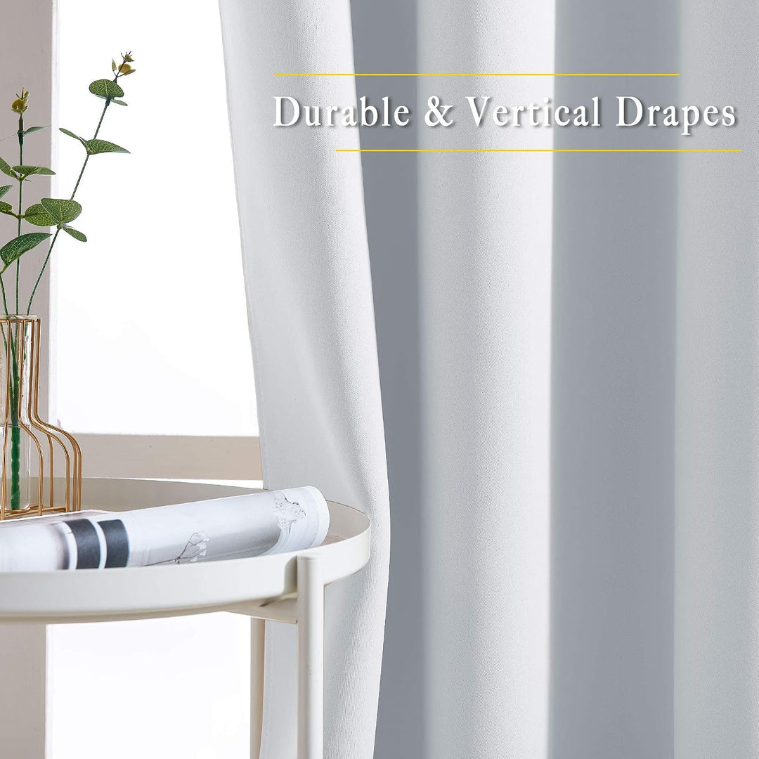 Greyish white curtain drape and texture close-up
