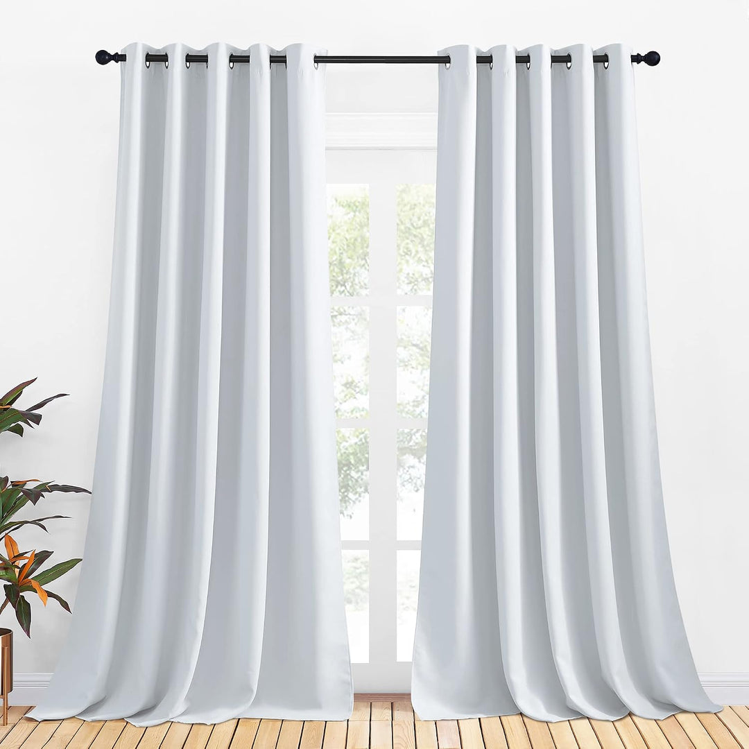 Greyish white 70 x 95 inch grommet curtain pair in a room