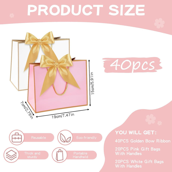 White and pink mini paper gift bags with gold handles and bows