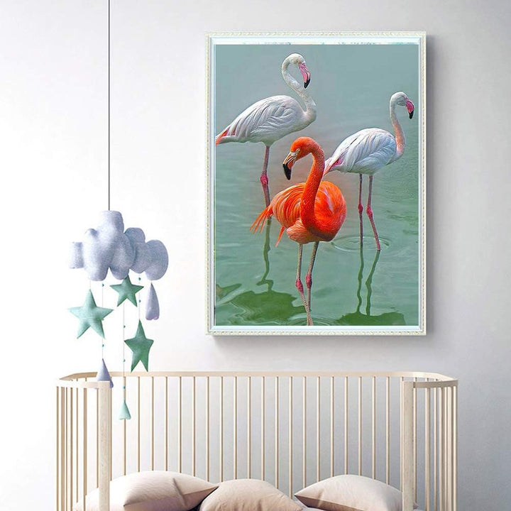 Three flamingos diamond painting displayed in a room