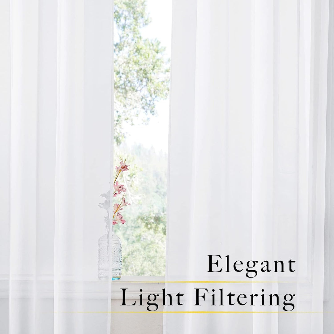 White sheer curtains filtering daylight at a window